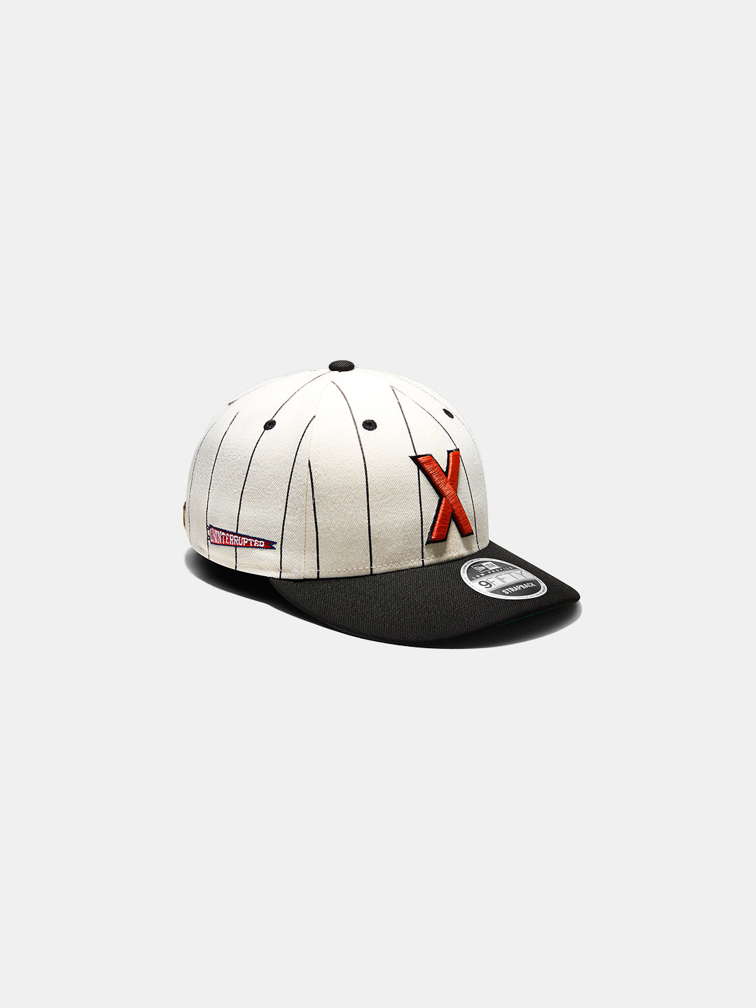 Cuban X Giants X UNINTERRUPTED Low Profile 9FIFTY - striped hat with an X logo on the front.