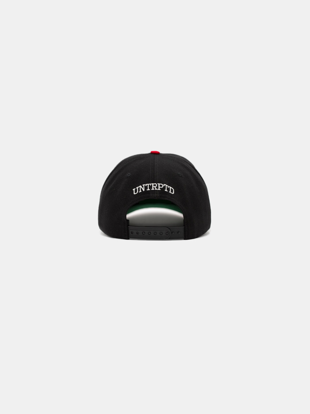 back of un chosen snapback hat in black and red