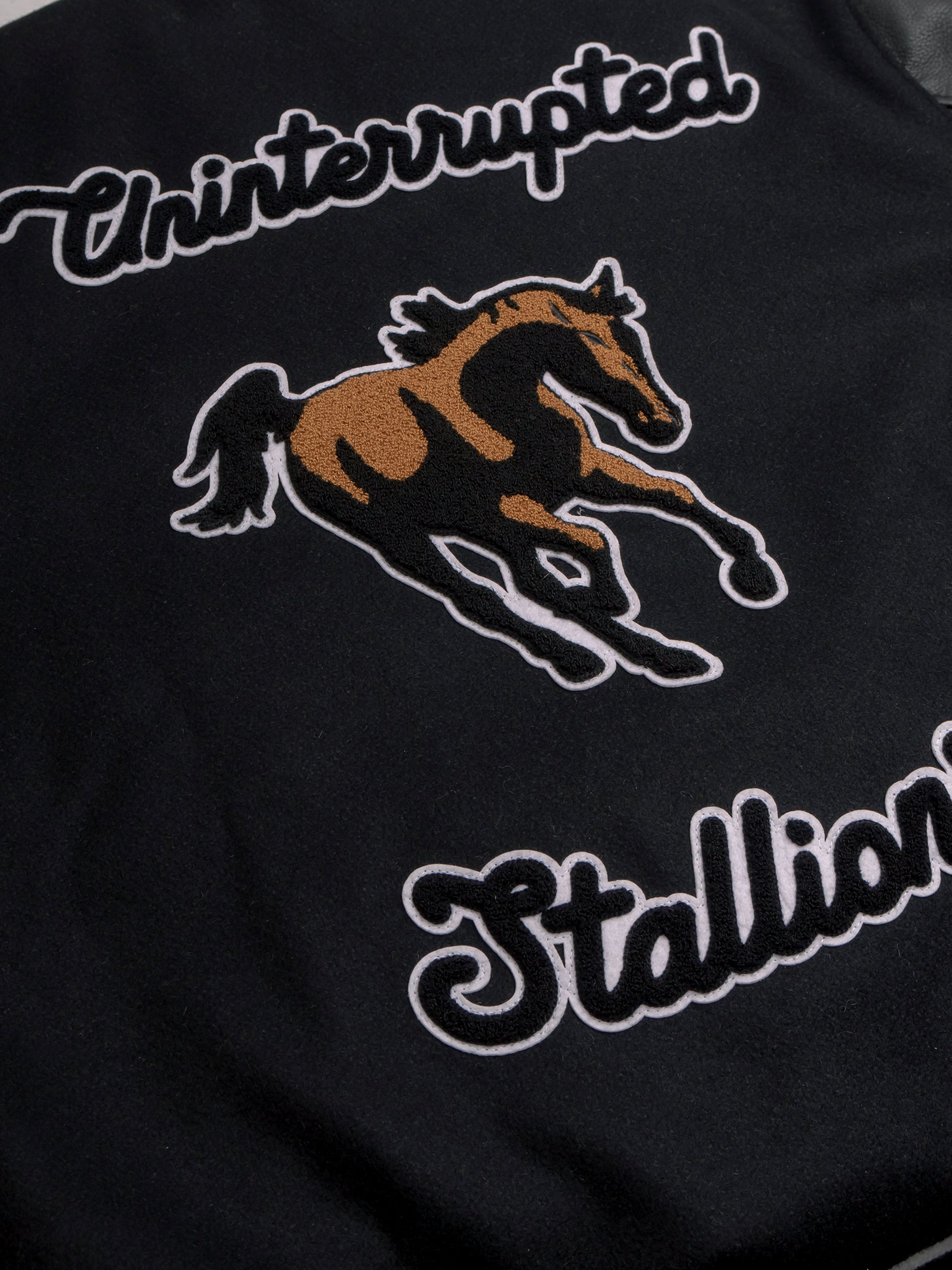 UNINTERRUPTED Stallions Black Varsity Jacket by Settlemier's