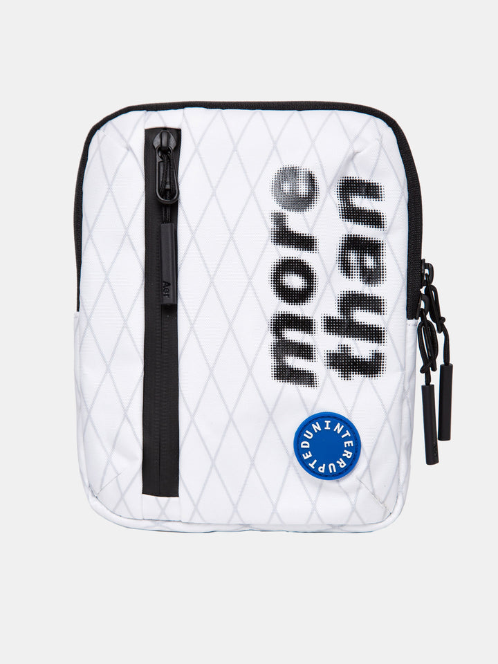 front view of the white pouch with a zipper and "more than" written on it