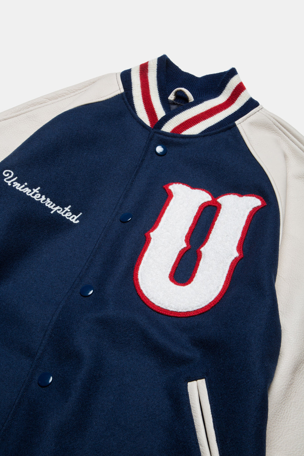 UNINTERRUPTED X GOLDEN BEAR ALL STAR VARSITY JACKET BLUE (4458685235280) - closer up view of the top of the jacket