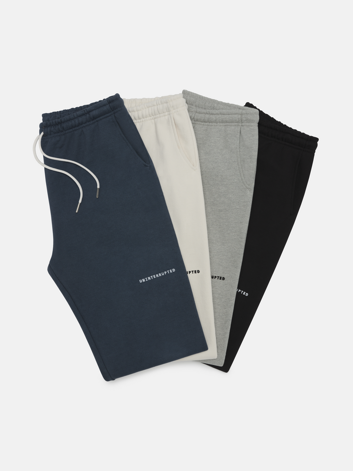 Fundamentals Brushed Fleece Sweatpant Collection- flatlay of the four colors of the collection